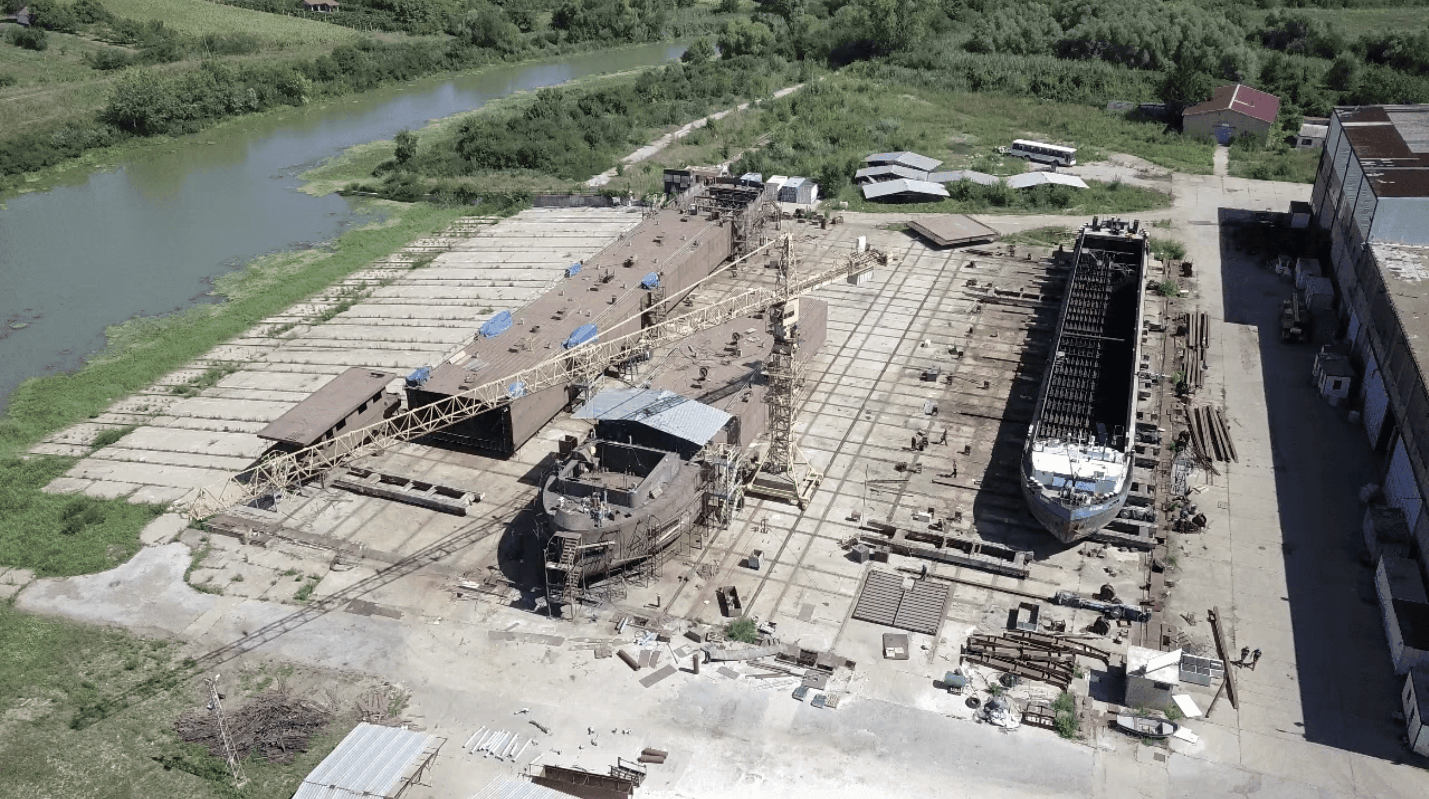 Aerial view of Rubikon shipyard construction site near the river